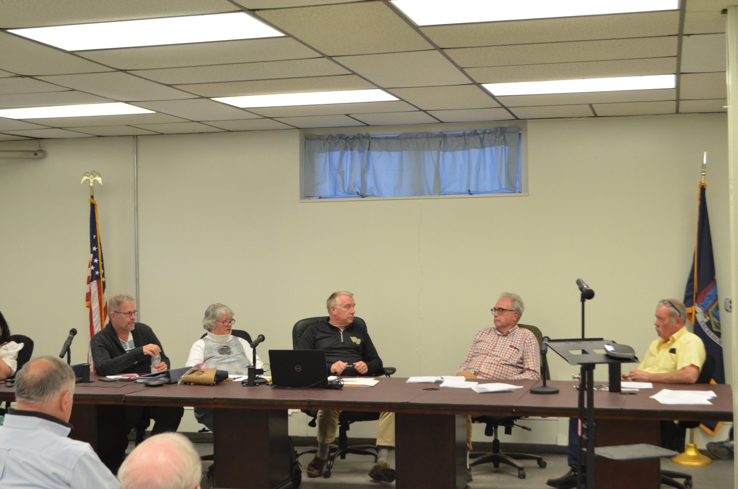 The Tusten town board deliberating on the fate of 93 Main Street.